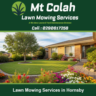 Striped lawn beside colorful flower beds at brick home in Hornsby NSW
